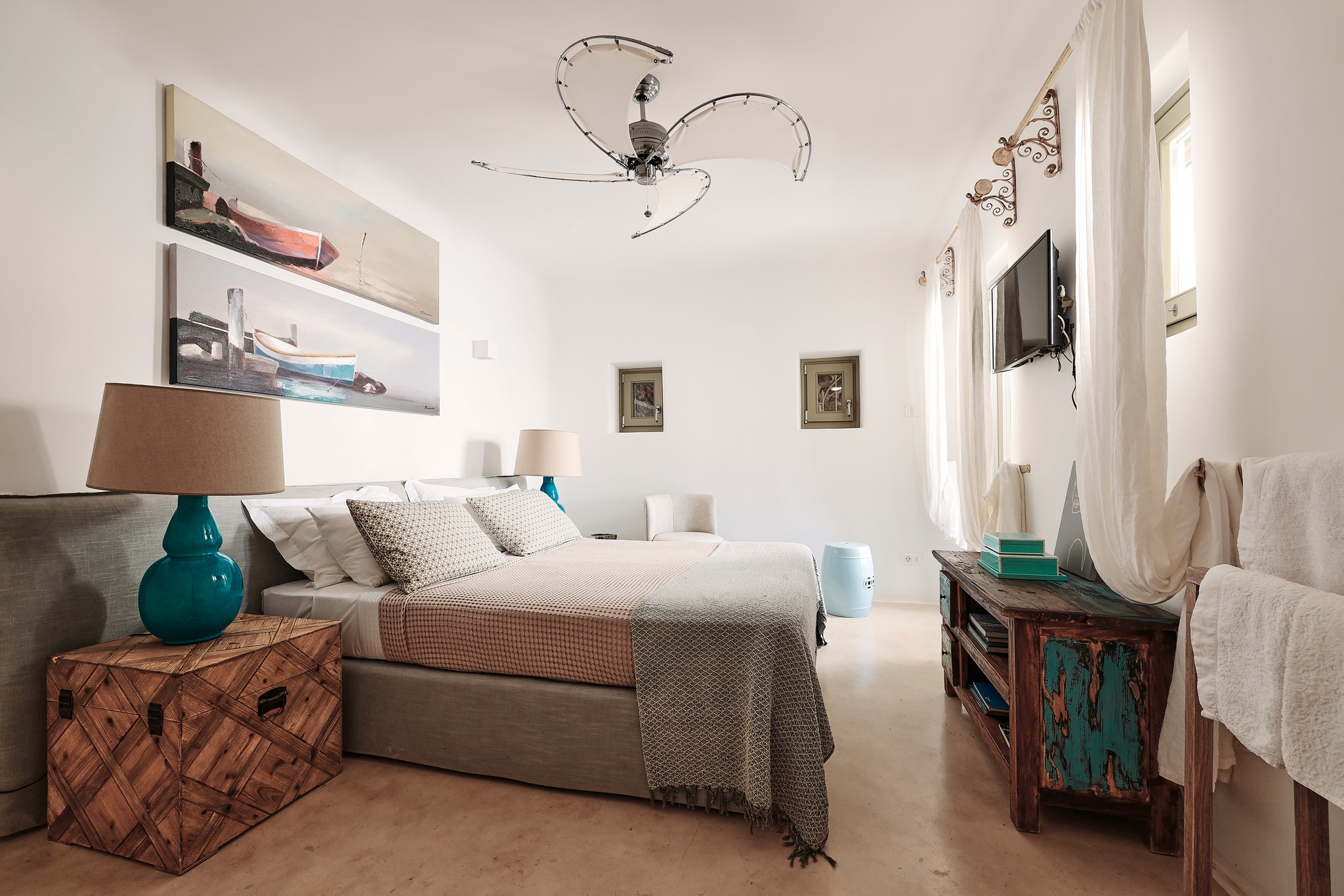 En suite bedroom on the upper level of the main house at Bali Sea Front Villa in Ftelia, Mykonos