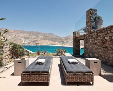 Shared veranda of the lower-level bedrooms at Bali Sea Front Villa in Ftelia, Mykonos