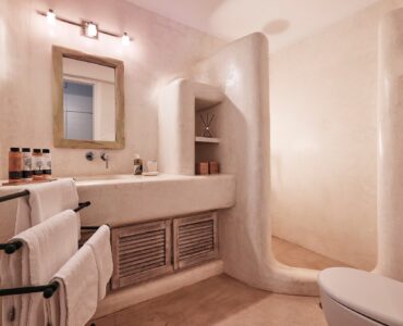 En suite bedroom on the lower level of the main house at Bali Sea Front Villa in Ftelia, Mykonos