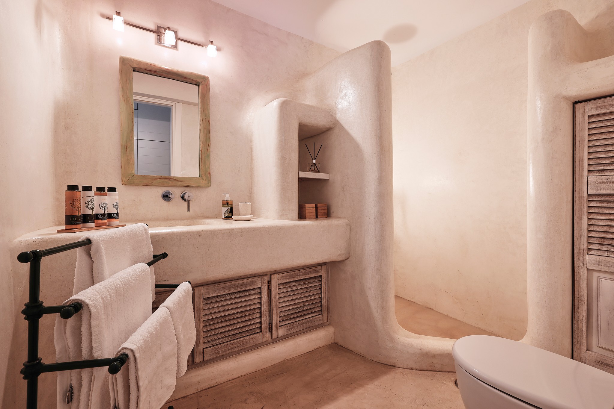 En suite bedroom on the lower level of the main house at Bali Sea Front Villa in Ftelia, Mykonos