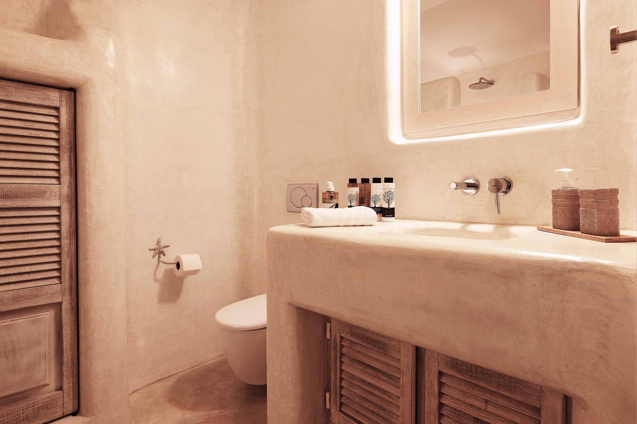 En suite bedroom on the lower level of the main house at Bali Sea Front Villa in Ftelia, Mykonos