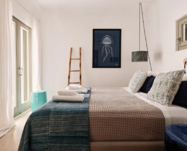 En suite bedroom on the upper level of the main house at Bali Sea Front Villa in Ftelia, Mykonos