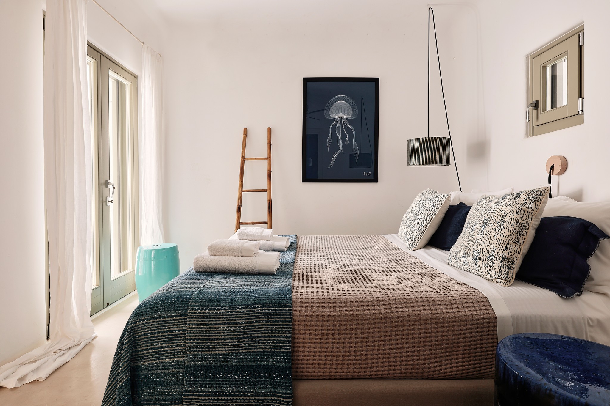 En suite bedroom on the upper level of the main house at Bali Sea Front Villa in Ftelia, Mykonos
