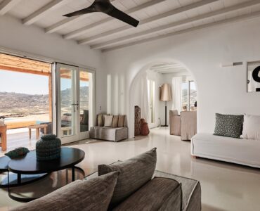 Living area with traditional Mykonian character at Bali Sea Front Villa in Ftelia, Mykonos