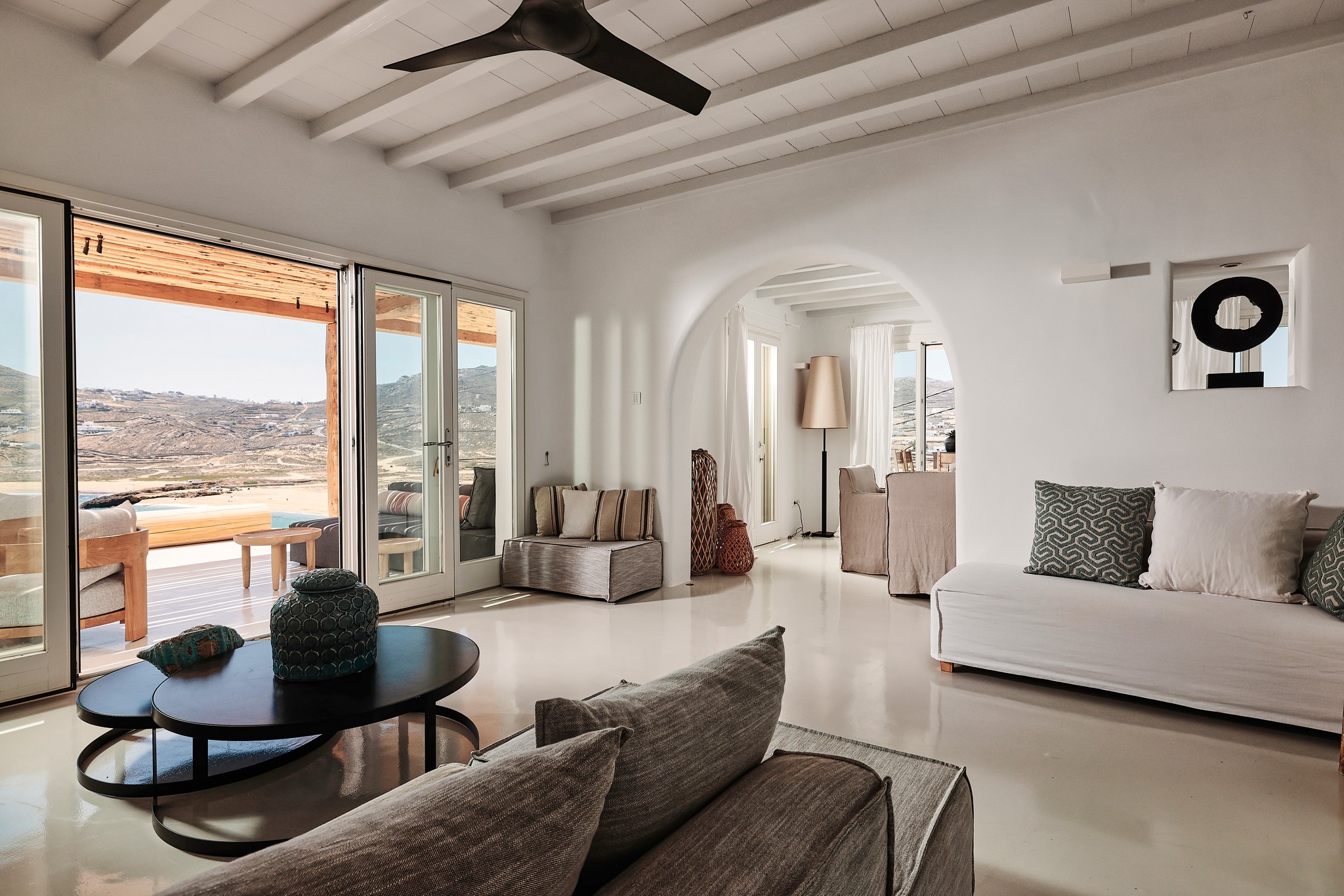 Living area with traditional Mykonian character at Bali Sea Front Villa in Ftelia, Mykonos