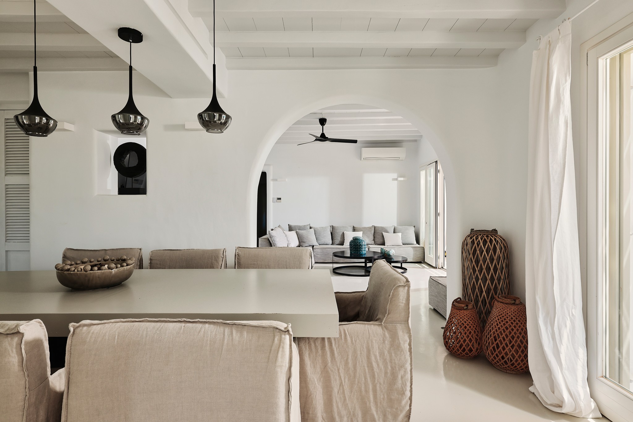 Living area with traditional Mykonian character at Bali Sea Front Villa in Ftelia, Mykonos