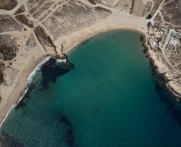 Aerial view of Ftelia bay and the sea front villa at Bali Sea Front Villa in Ftelia, Mykonos