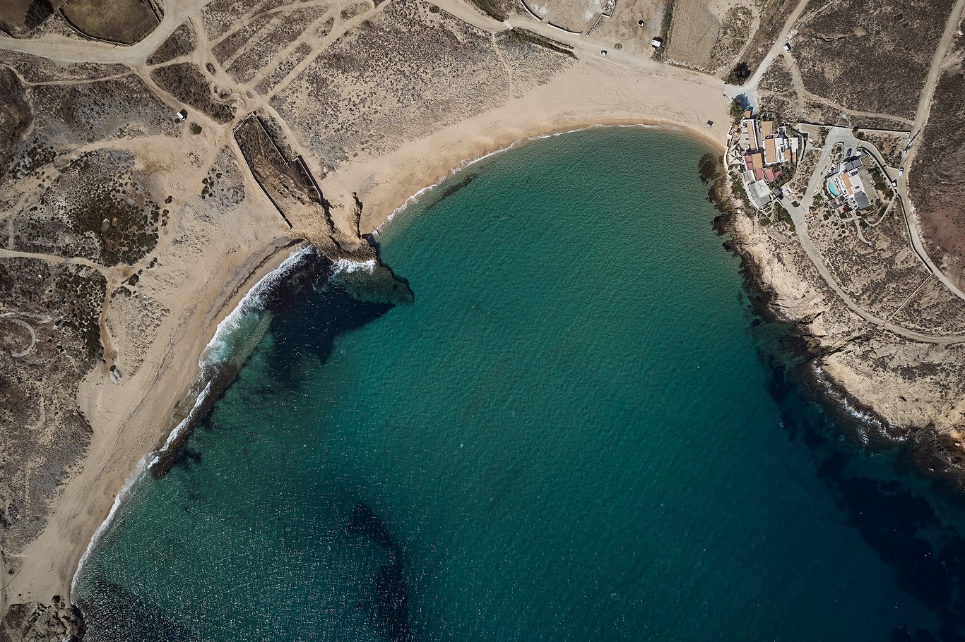 Aerial view of Ftelia bay and the sea front villa at Bali Sea Front Villa in Ftelia, Mykonos