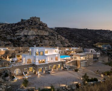 Grand Kanalia estate at dusk on the Kanalia hillside overlooking the Aegean – Grand Kanalia estate for sale in Kanalia, Mykonos