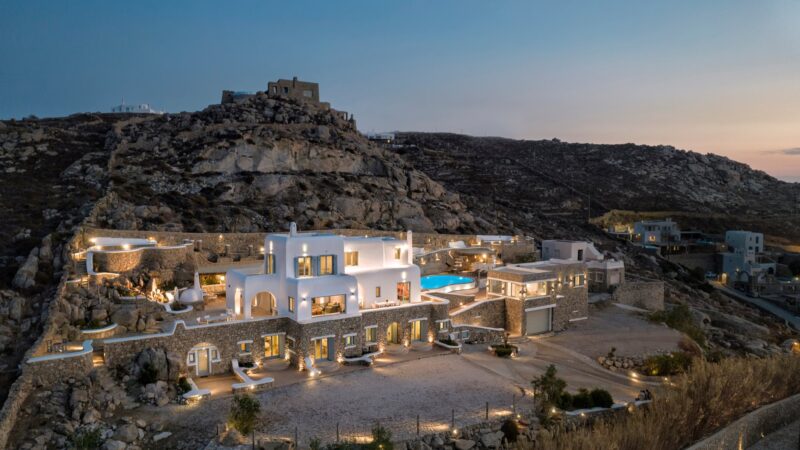 Grand Kanalia estate at dusk on the Kanalia hillside overlooking the Aegean – Grand Kanalia estate for sale in Kanalia, Mykonos