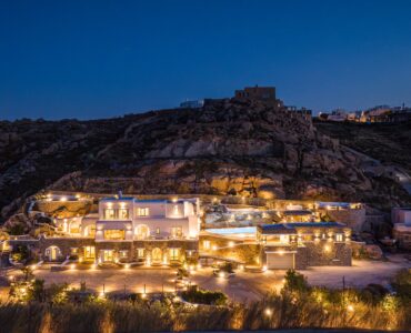 The estate illuminated at twilight on the hillside – Grand Kanalia estate for sale in Kanalia, Mykonos