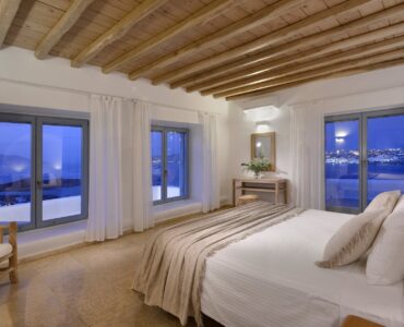 Double bedroom with wooden ceiling and sea views – Grand Kanalia estate for sale in Kanalia, Mykonos