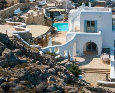 Main villa, pool and terraces on the rocky hillside – Grand Kanalia estate for sale in Kanalia, Mykonos