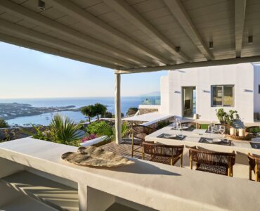 J-View Villa, Agios Lazaros, Mykonos – shaded terrace dining with views over Mykonos