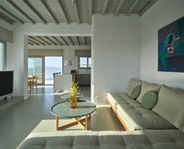 J-View Villa, Agios Lazaros, Mykonos – living room with sofa and artwork