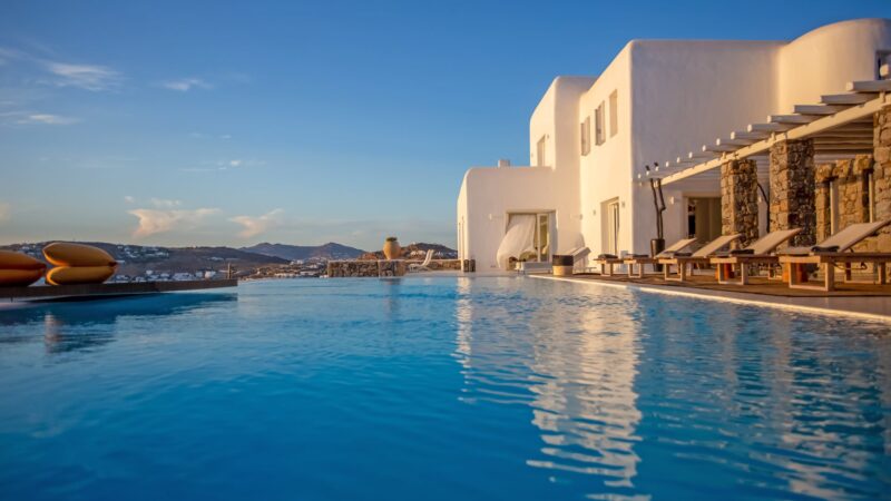 Infinity pool and the villa at Maison Haute in Aleomandra, Mykonos