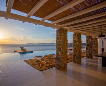 Covered terrace at sunset at Maison Haute in Aleomandra, Mykonos
