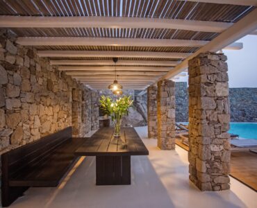 Shaded outdoor dining under the pergola at Maison Haute in Aleomandra, Mykonos