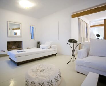 Lounge with sea-view windows at Maison Haute in Aleomandra, Mykonos
