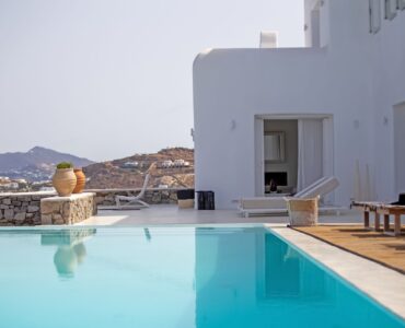Pool with view over the bay at Maison Haute in Aleomandra, Mykonos