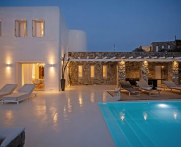 Pool terrace at dusk at Maison Haute in Aleomandra, Mykonos