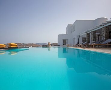 Long infinity pool along the villa at Maison Haute in Aleomandra, Mykonos