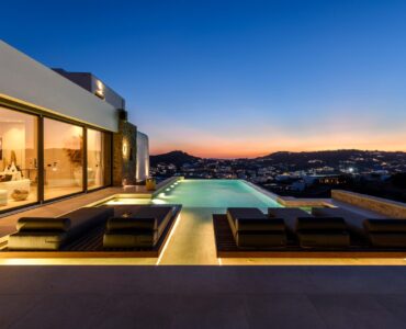 Sunset over the pool at Muse Mansion in Agios Lazaros, Mykonos