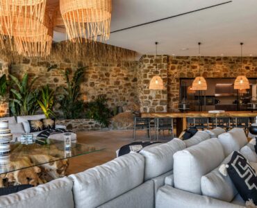 Living room with rattan pendants at Muse Mansion in Agios Lazaros, Mykonos