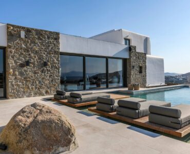 Pool and stone-clad villa at Muse Mansion in Agios Lazaros, Mykonos