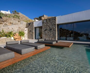 Pool with sun loungers at Muse Mansion in Agios Lazaros, Mykonos