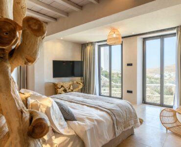 Bedroom with driftwood sculpture at Muse Mansion in Agios Lazaros, Mykonos