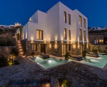 Villa lit at dusk at Muse Mansion in Agios Lazaros, Mykonos