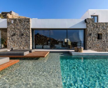 Pool and villa facade at Muse Mansion in Agios Lazaros, Mykonos
