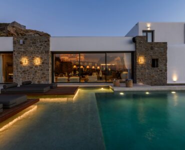 Pool lit at dusk at Muse Mansion in Agios Lazaros, Mykonos