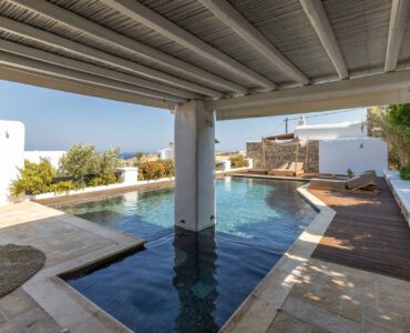 Covered veranda by the pool at Platinum Deluxe Villa in Kalafatis, Mykonos