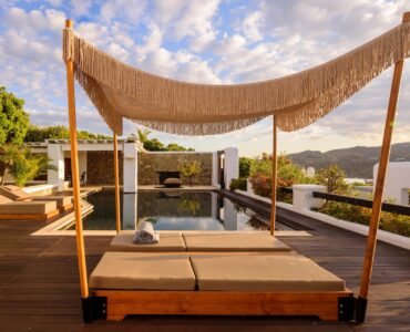 Canopy daybed on the pool deck at Platinum Deluxe Villa in Kalafatis, Mykonos