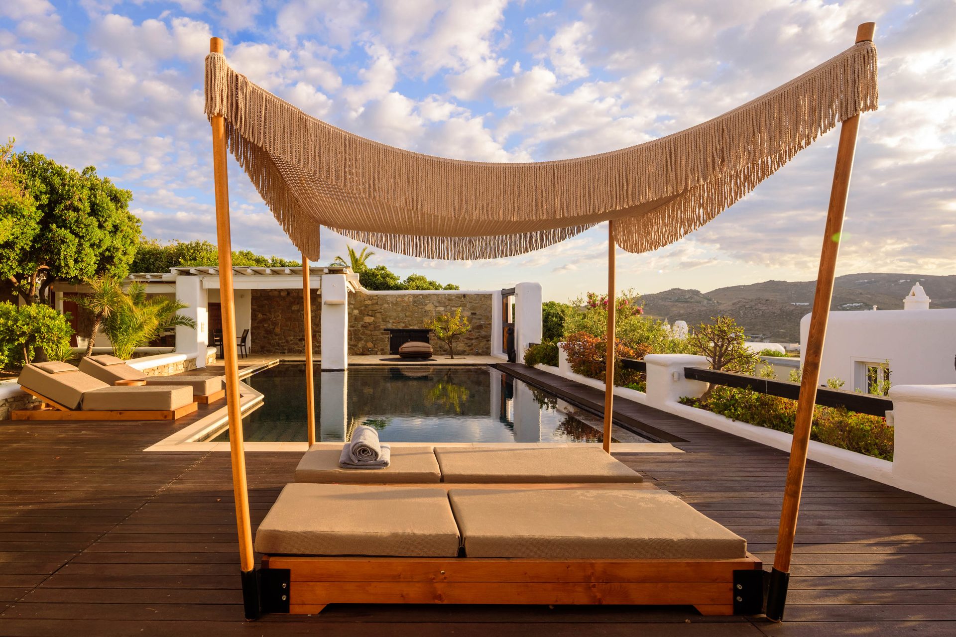 Canopy daybed on the pool deck at Platinum Deluxe Villa in Kalafatis, Mykonos