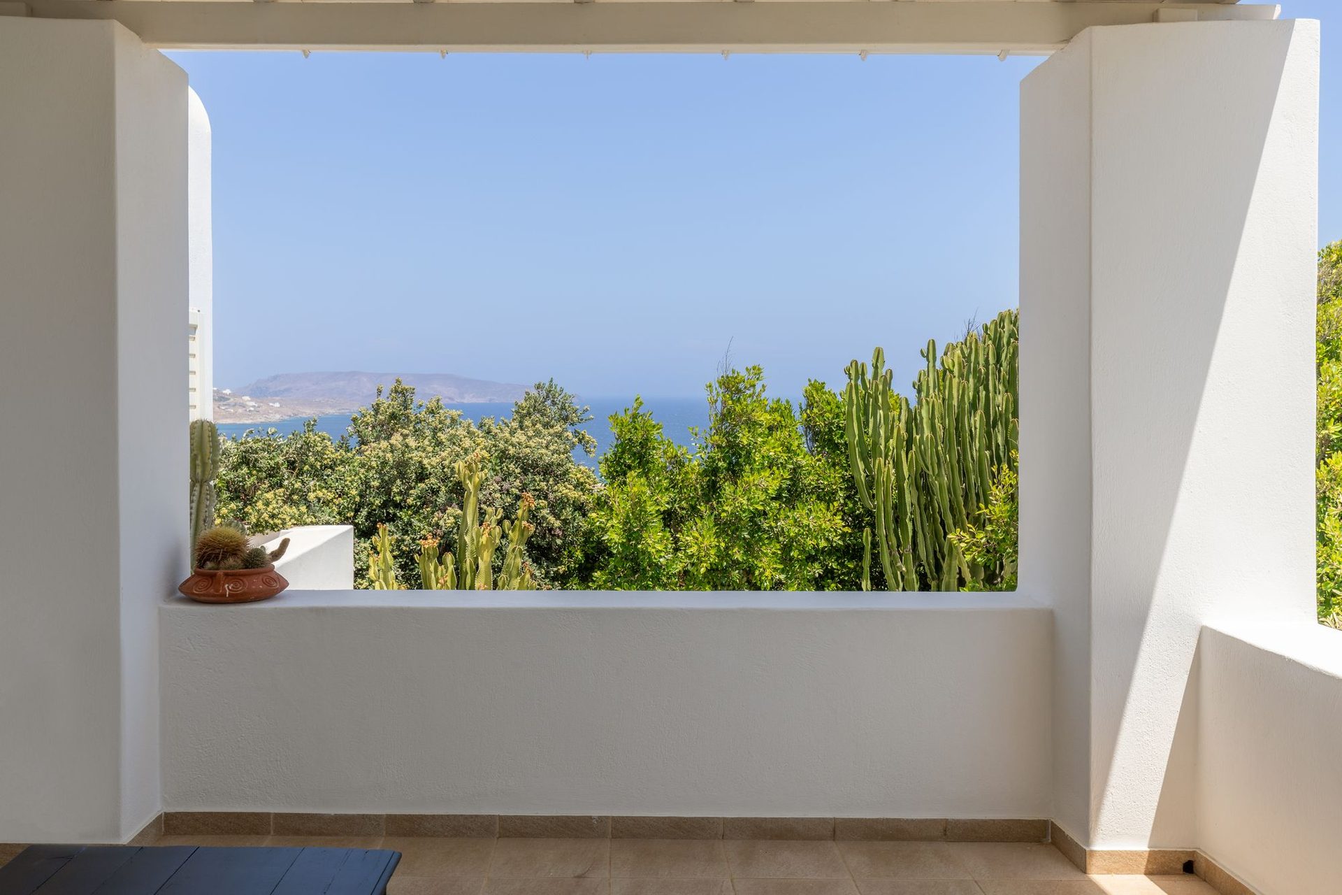 Covered balcony with garden and sea view at Platinum Deluxe Villa in Kalafatis, Mykonos