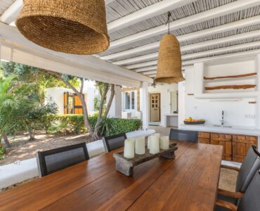 Dining area with garden view at Platinum Deluxe Villa in Kalafatis, Mykonos