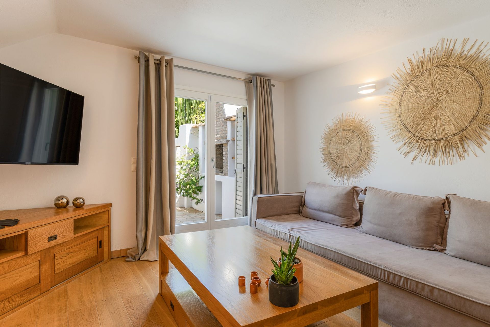 Living room with TV at Platinum Deluxe Villa in Kalafatis, Mykonos