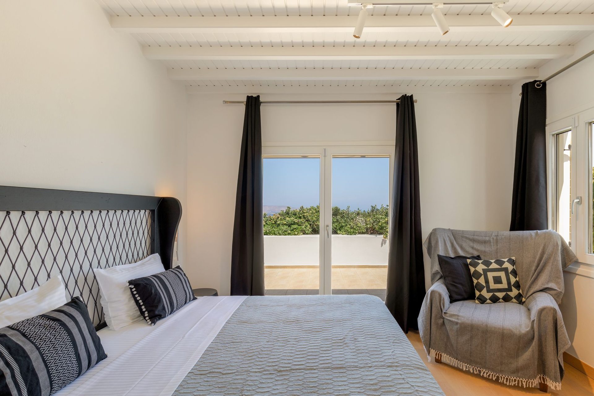 Bedroom with terrace door at Platinum Deluxe Villa in Kalafatis, Mykonos