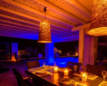 Covered dining area at dusk at Platinum Deluxe Villa in Kalafatis, Mykonos