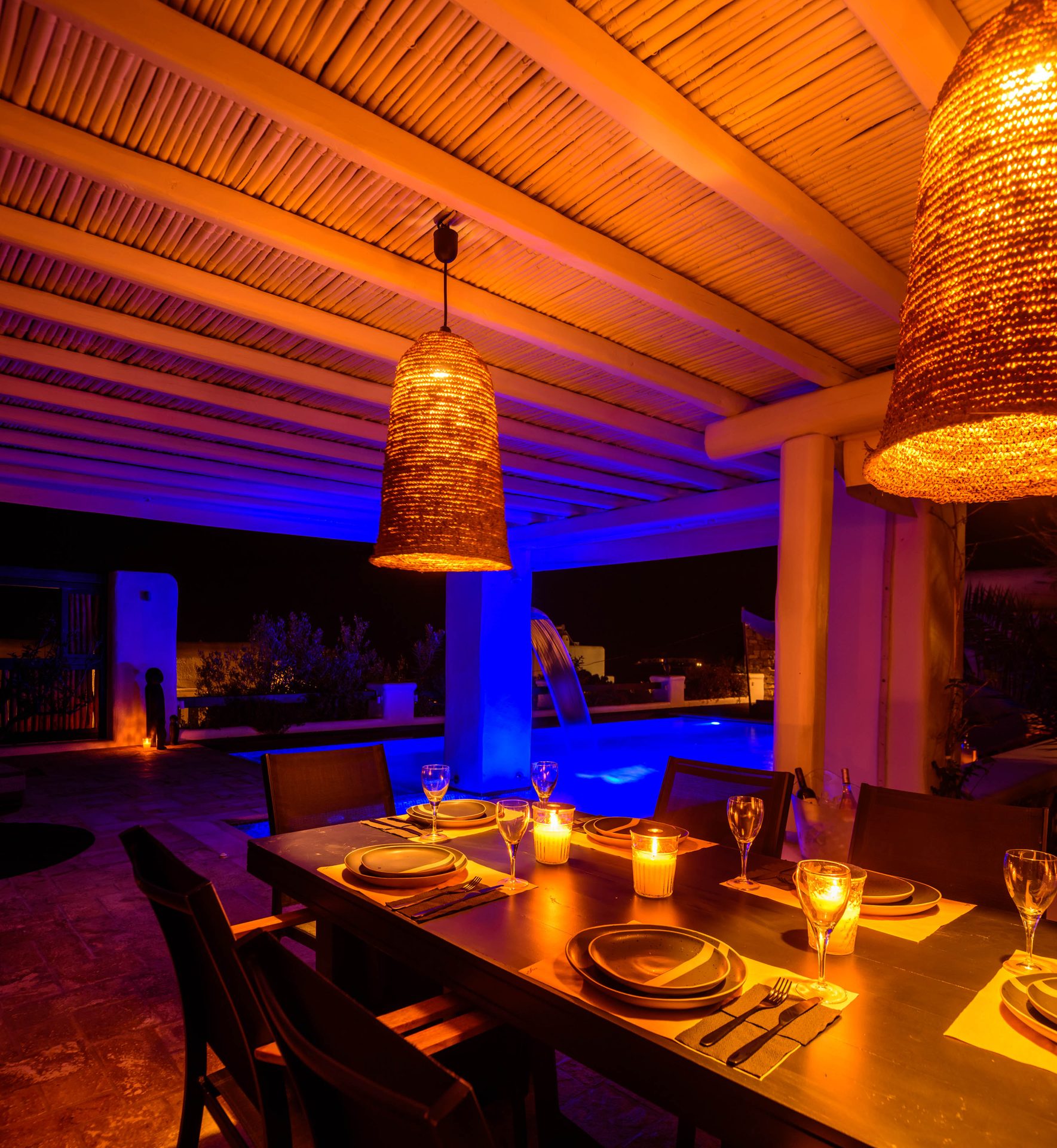 Covered dining area at dusk at Platinum Deluxe Villa in Kalafatis, Mykonos