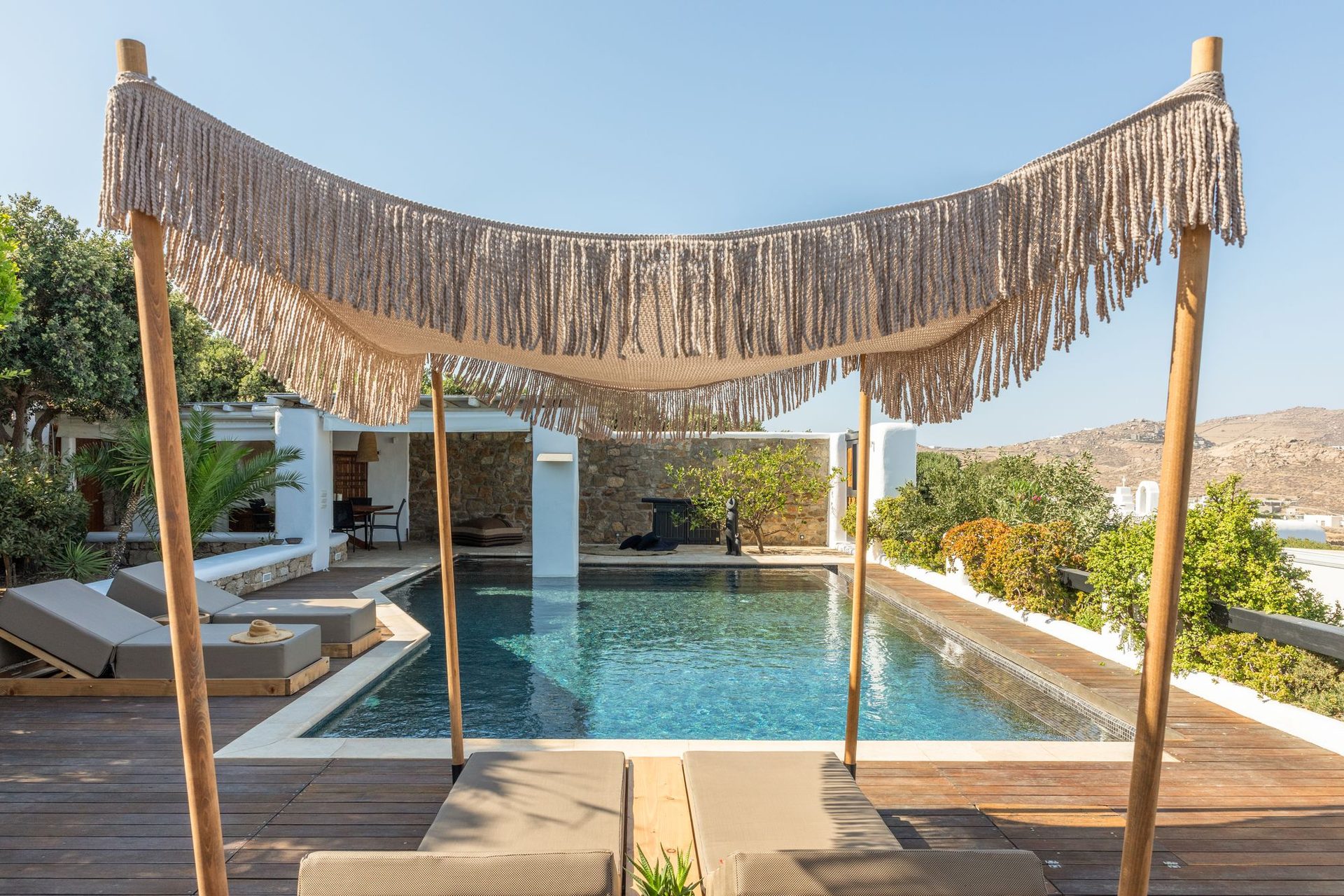 Pool with canopy shade at Platinum Deluxe Villa in Kalafatis, Mykonos