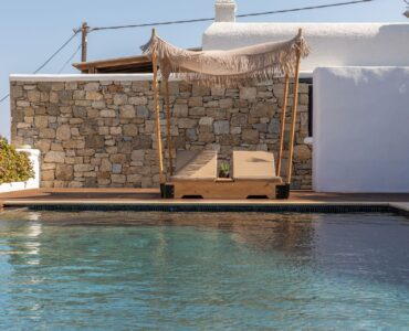 Pool and stone wall at Platinum Deluxe Villa in Kalafatis, Mykonos