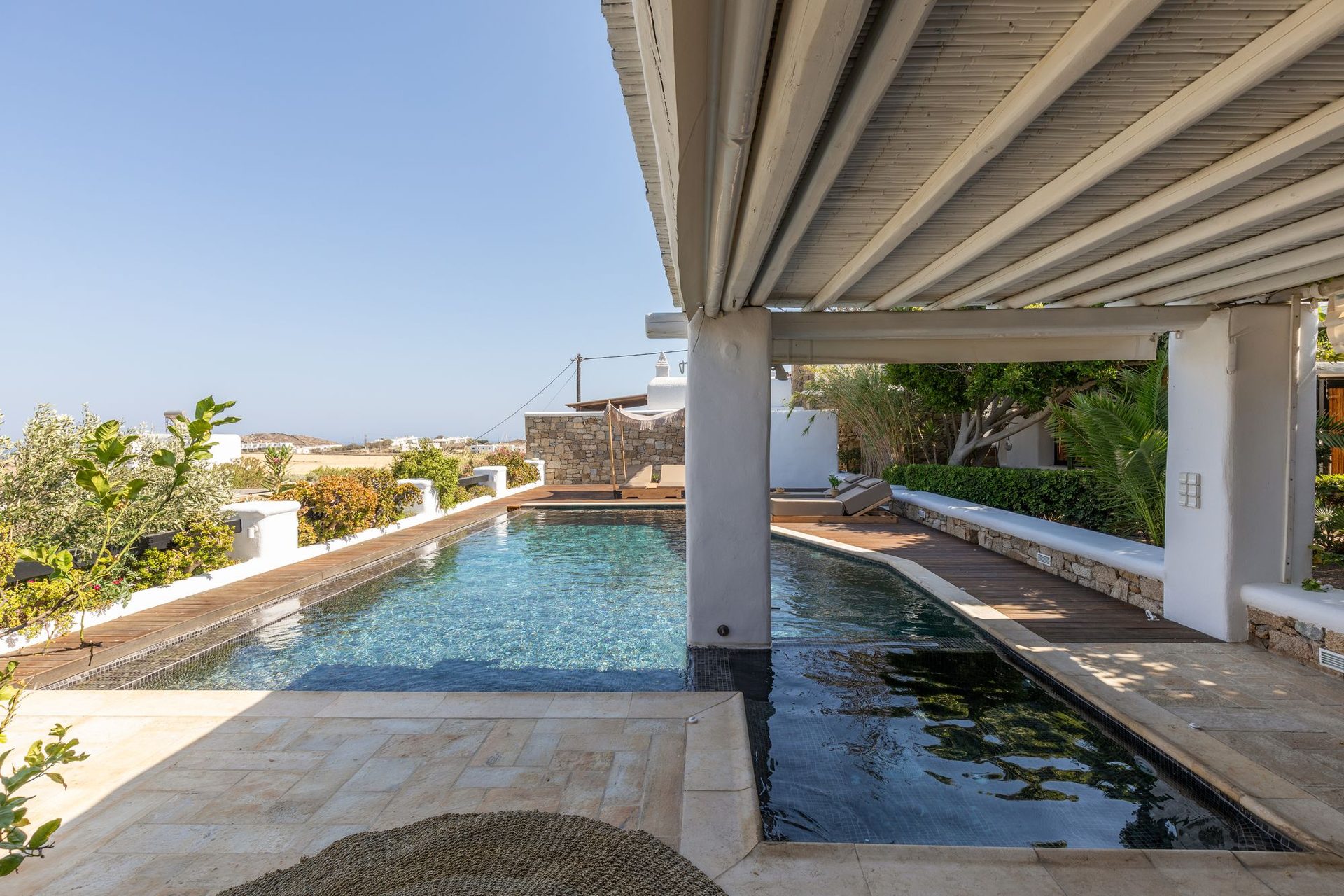 Pool from the covered veranda at Platinum Deluxe Villa in Kalafatis, Mykonos