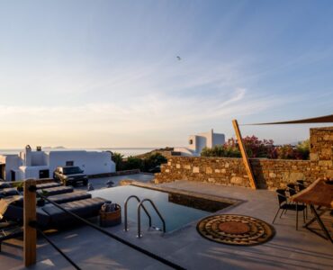 Pool terrace at sunset at Platinum Junior Villa in Kalafatis, Mykonos