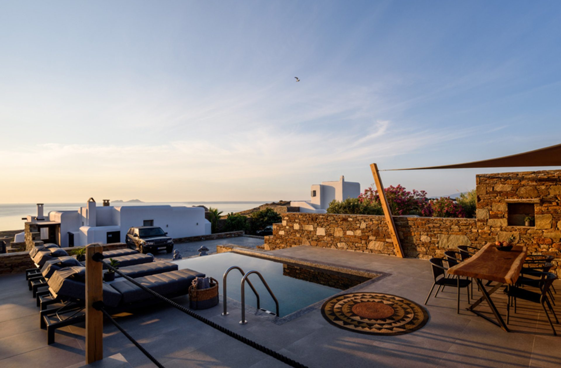 Pool terrace at sunset at Platinum Junior Villa in Kalafatis, Mykonos