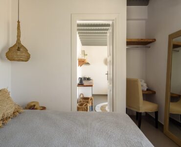 Bedroom with mirror at Platinum Junior Villa in Kalafatis, Mykonos