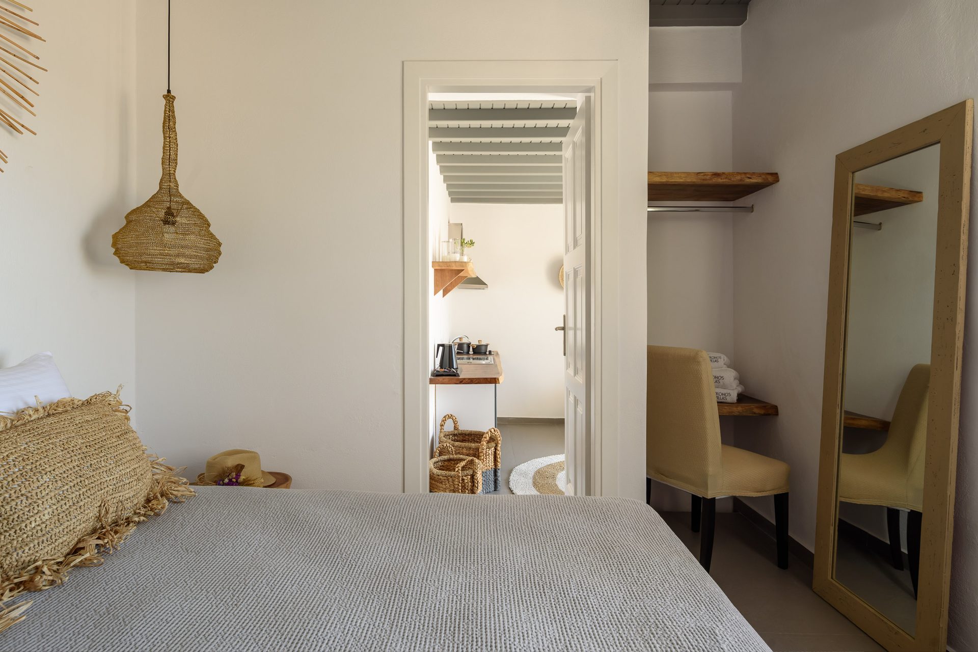 Bedroom with mirror at Platinum Junior Villa in Kalafatis, Mykonos